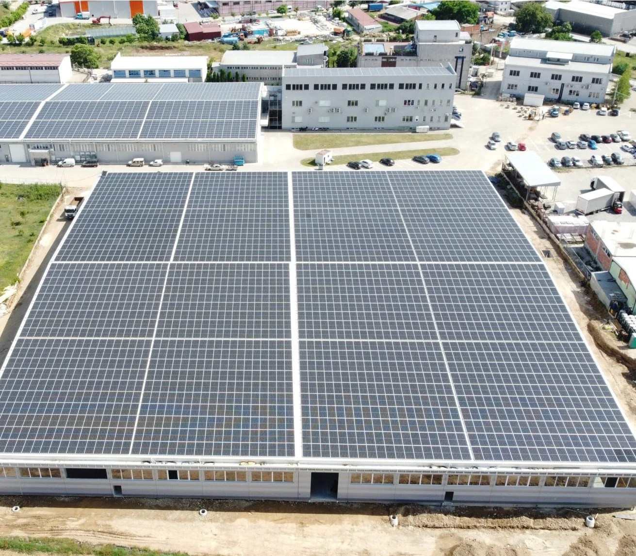 Photovoltaic panels installed on an industrial rooftop